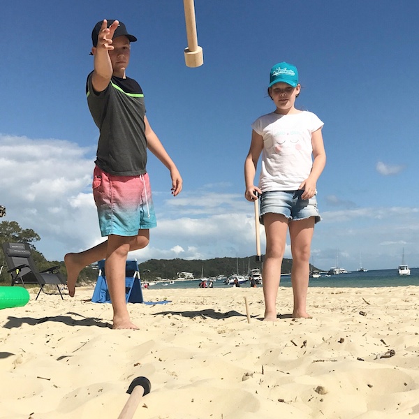 Play Crossbones outdoor games on the beach with the kids